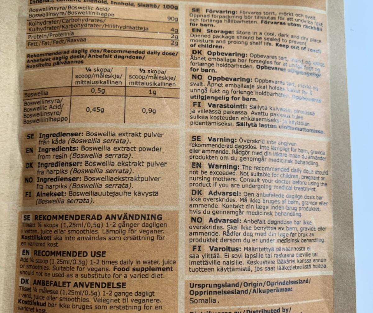 Baksida med innehåll och dosering 0,5 till 1 gram foto av oss