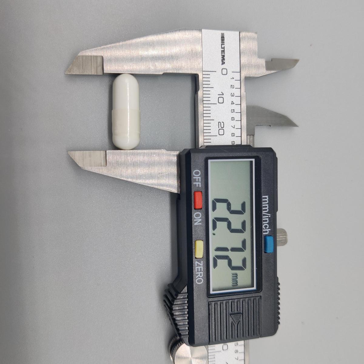Skjutmått visar kapsellängd cirka 22,7 mm Core Arginine Complex