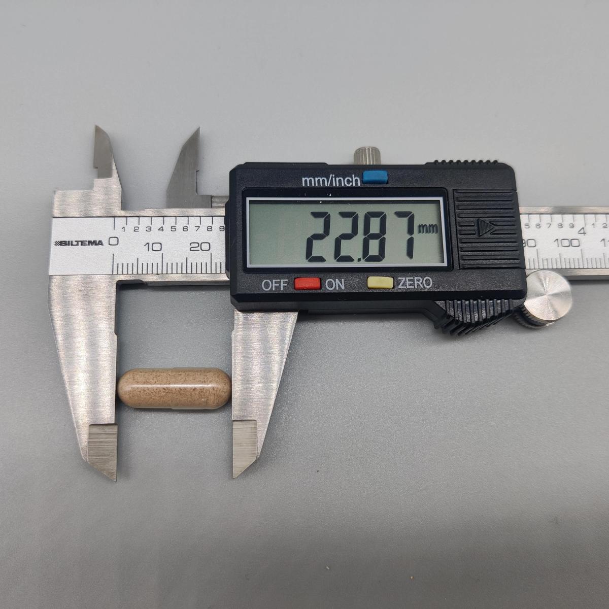 Kapsel från Core Joints uppmätt med skjutmått 22,87 mm dokumenterat av oss