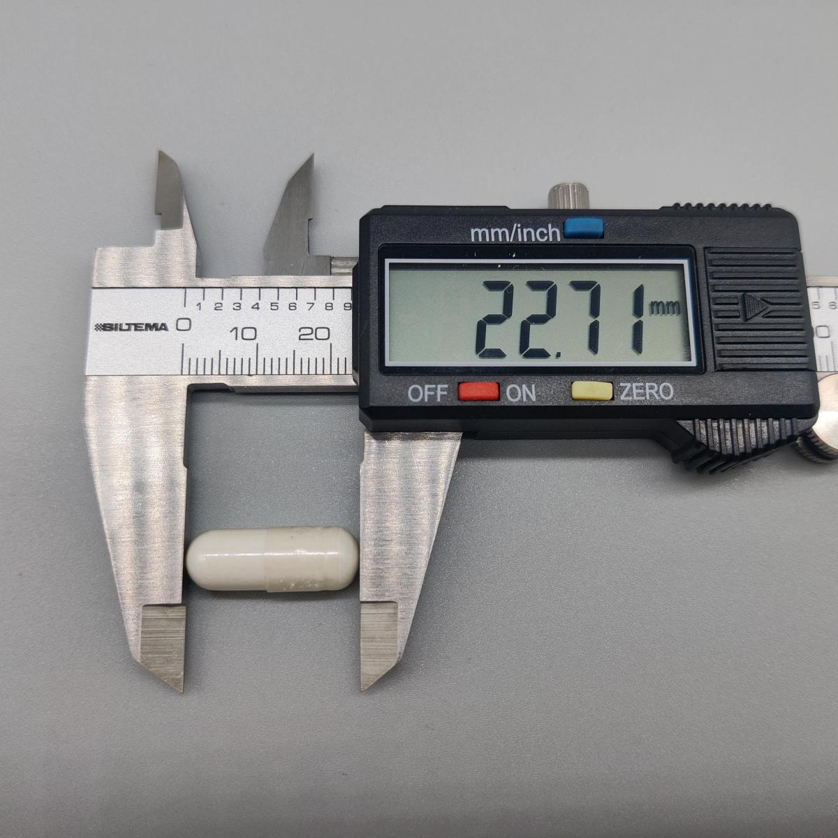 Skjutmått visar kapsellängd 22,7 mm för Core Lysine