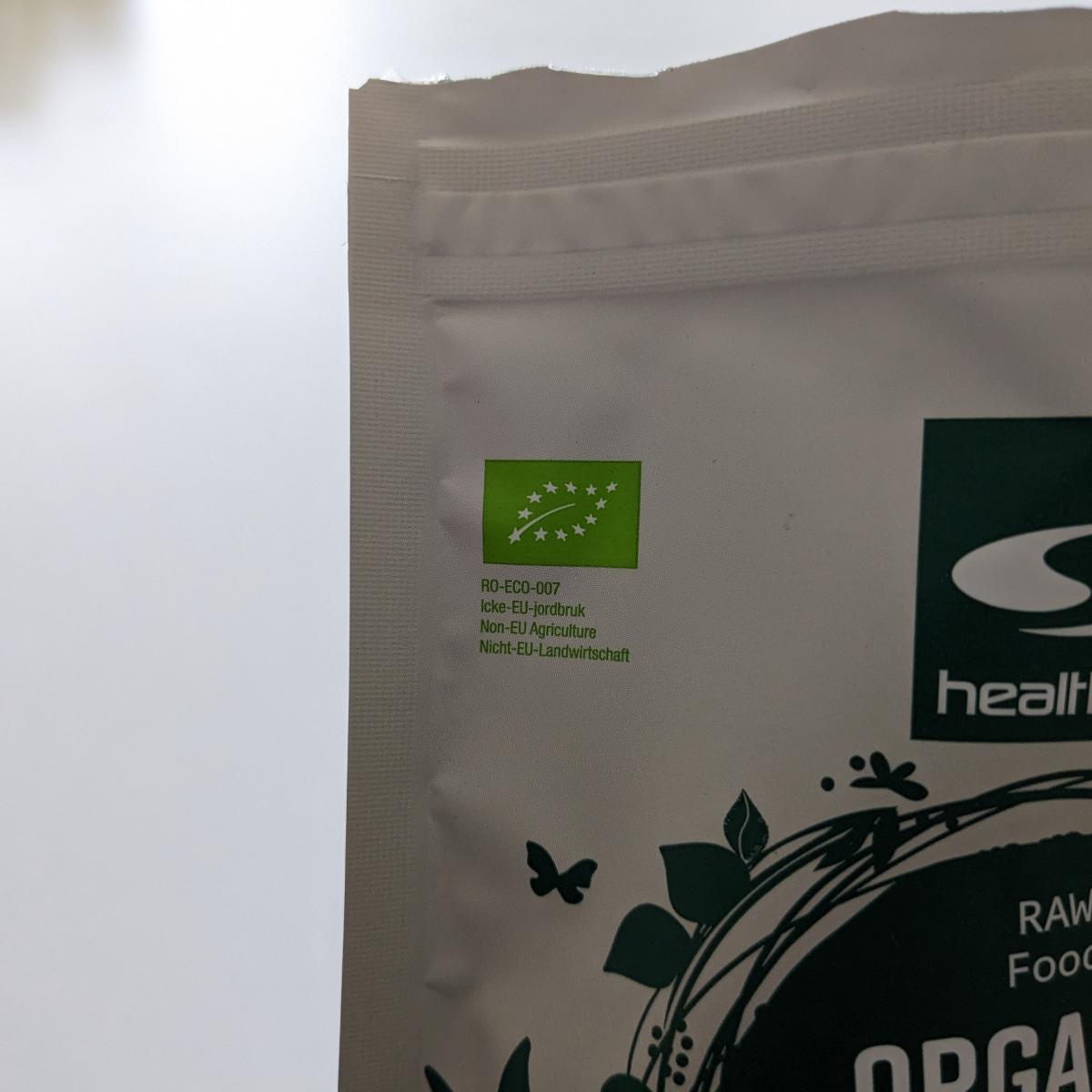 Baksida med svensk doseringsinfo på Healthwell Spirulina EKO, fotad av oss