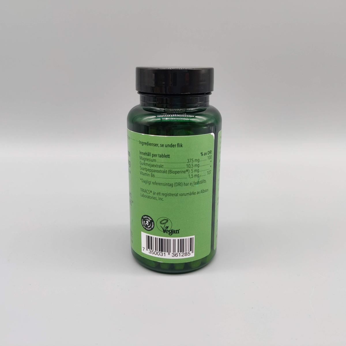 Etikett med rekommenderat intag på Great Earth Magnesium 375 mg, fotograferat i studio