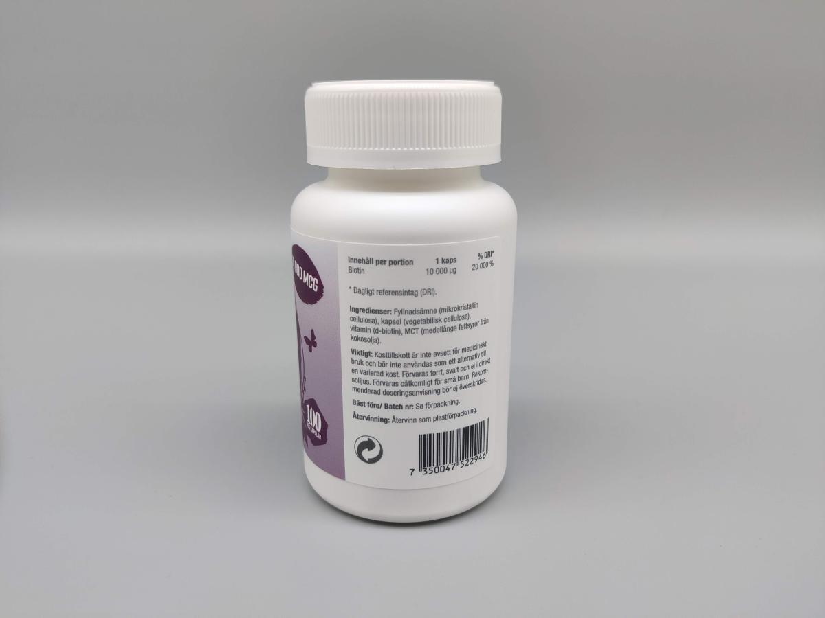 Baksida av Healthwell Biotin med ingredienslista och dos 10 000 µg