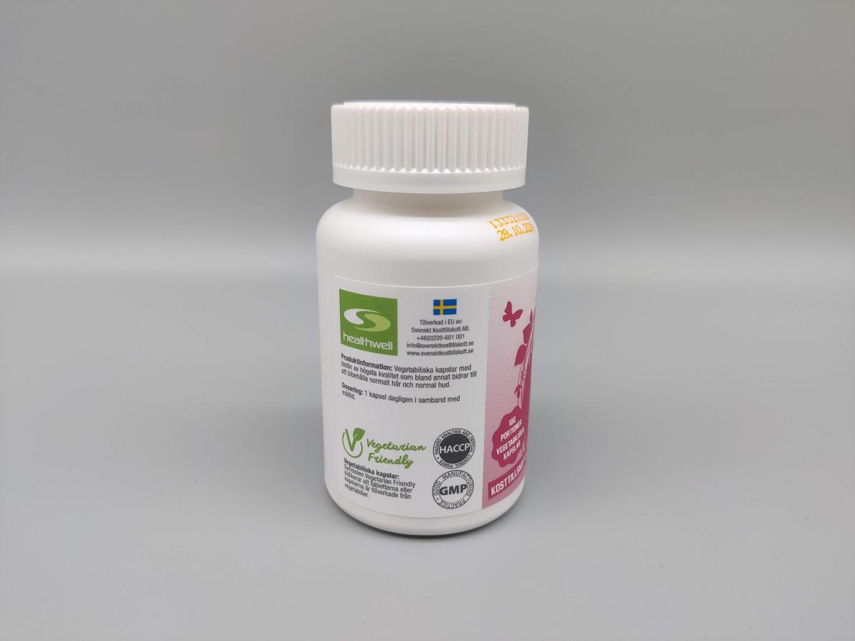 Healthwell Biotin 500 med kvalitetsmärkningar och svensk återförsäljare angiven, foto taget av oss