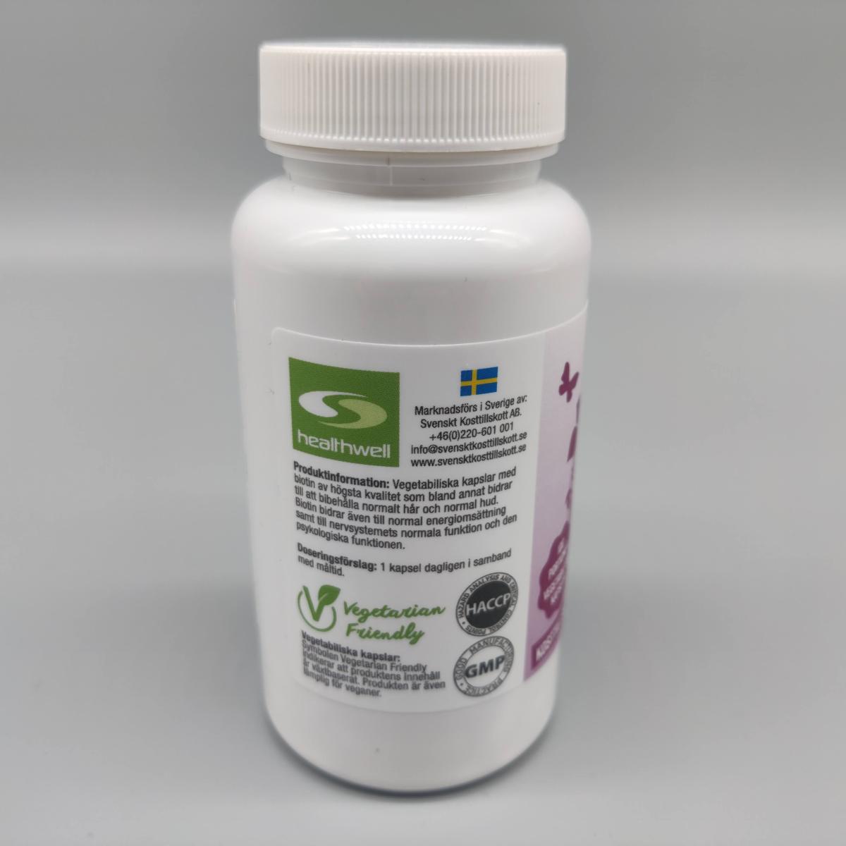 Baksida av Healthwell Biotin 5000 med Vegetarian Friendly och kvalitetsmärkningar foto av oss