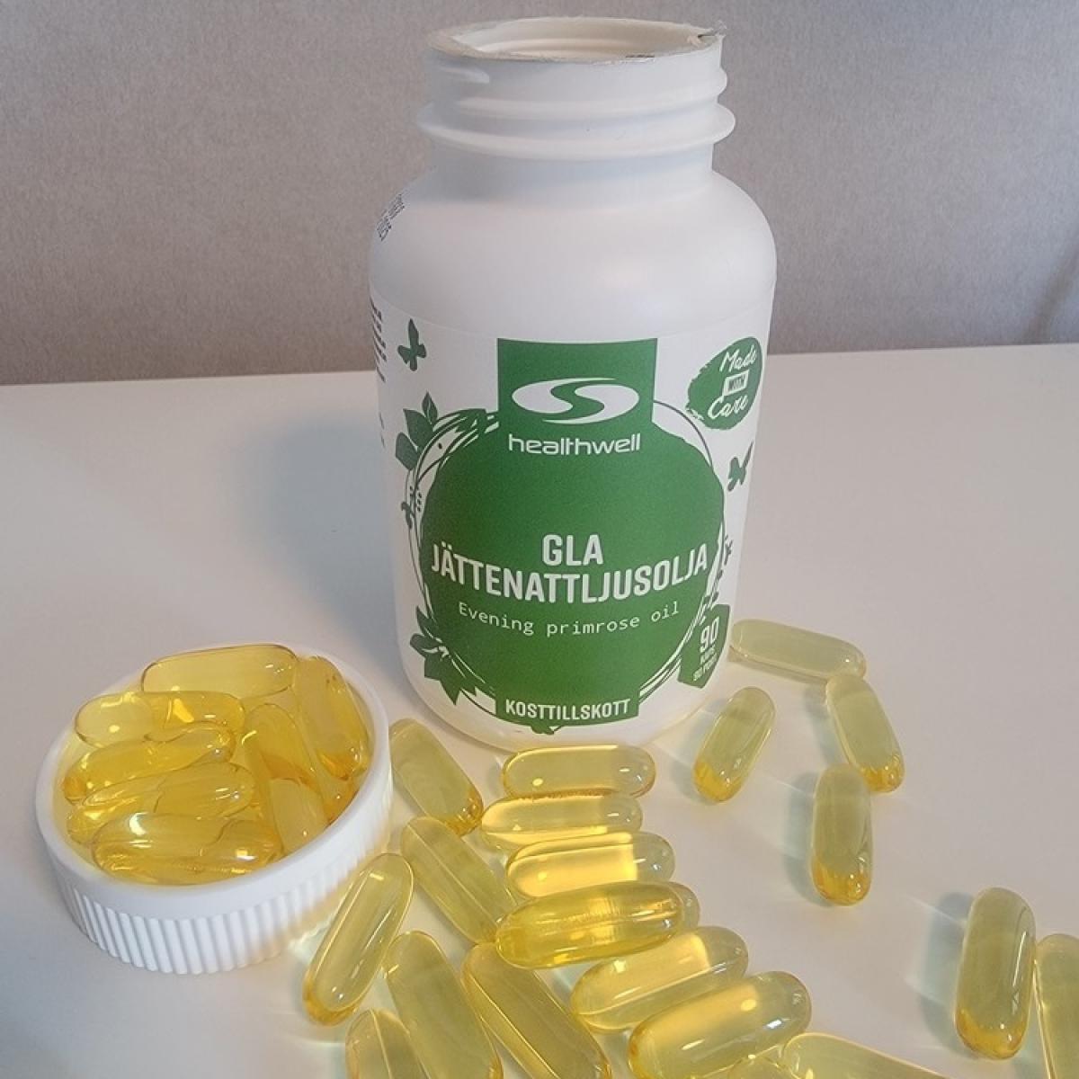 Egen bild tagen av oss av Healthwell GLA Jättenattljusolja med öppnad burk och kapslar
