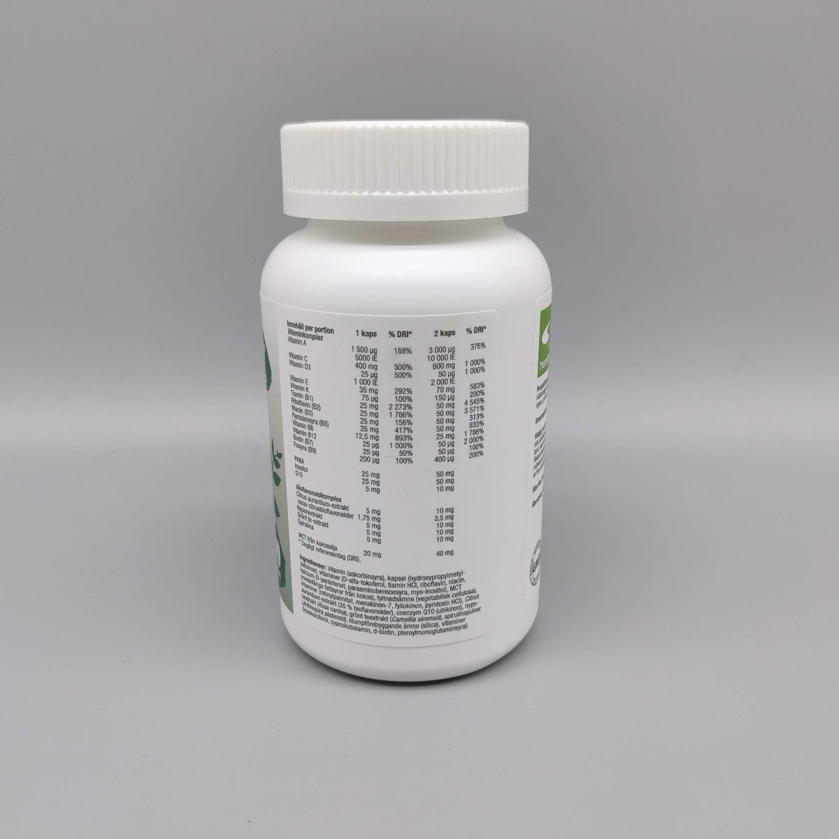 Baksida med näringsdeklaration på Healthwell MultiVitaminer foto av oss
