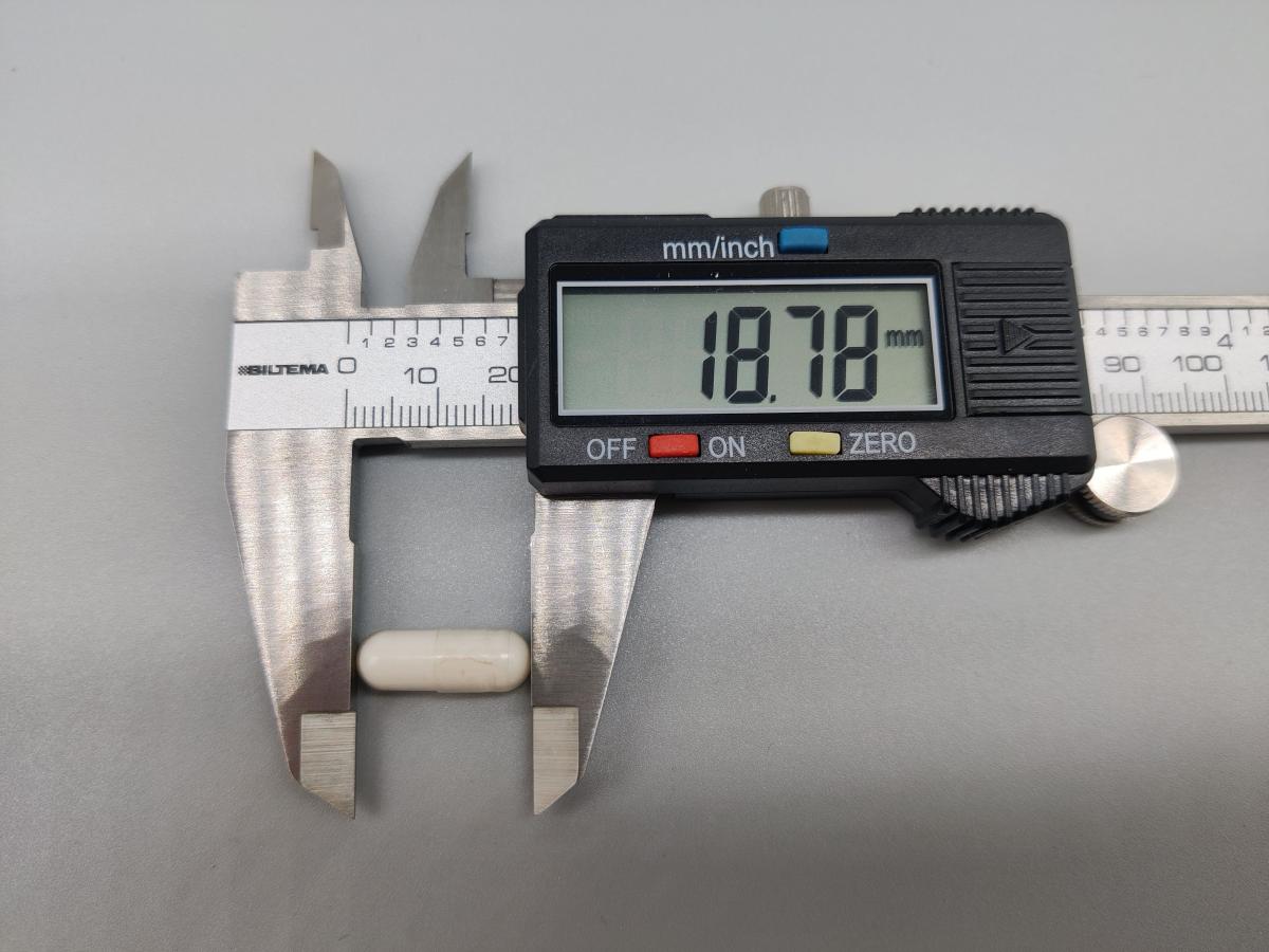 Skjutmått som visar kapselns längd 18,78 mm