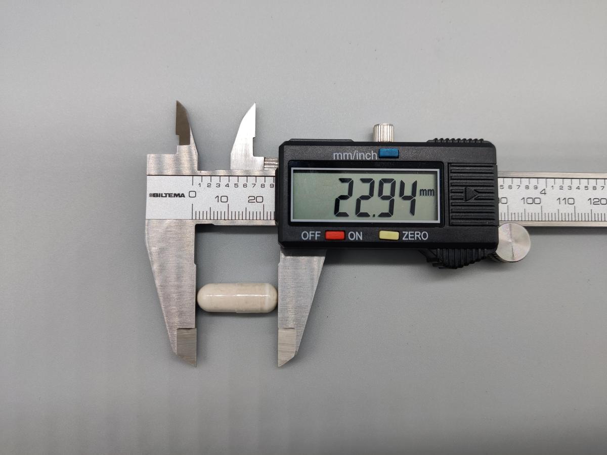 Kapselstorlek mätt av oss till 22,94 mm