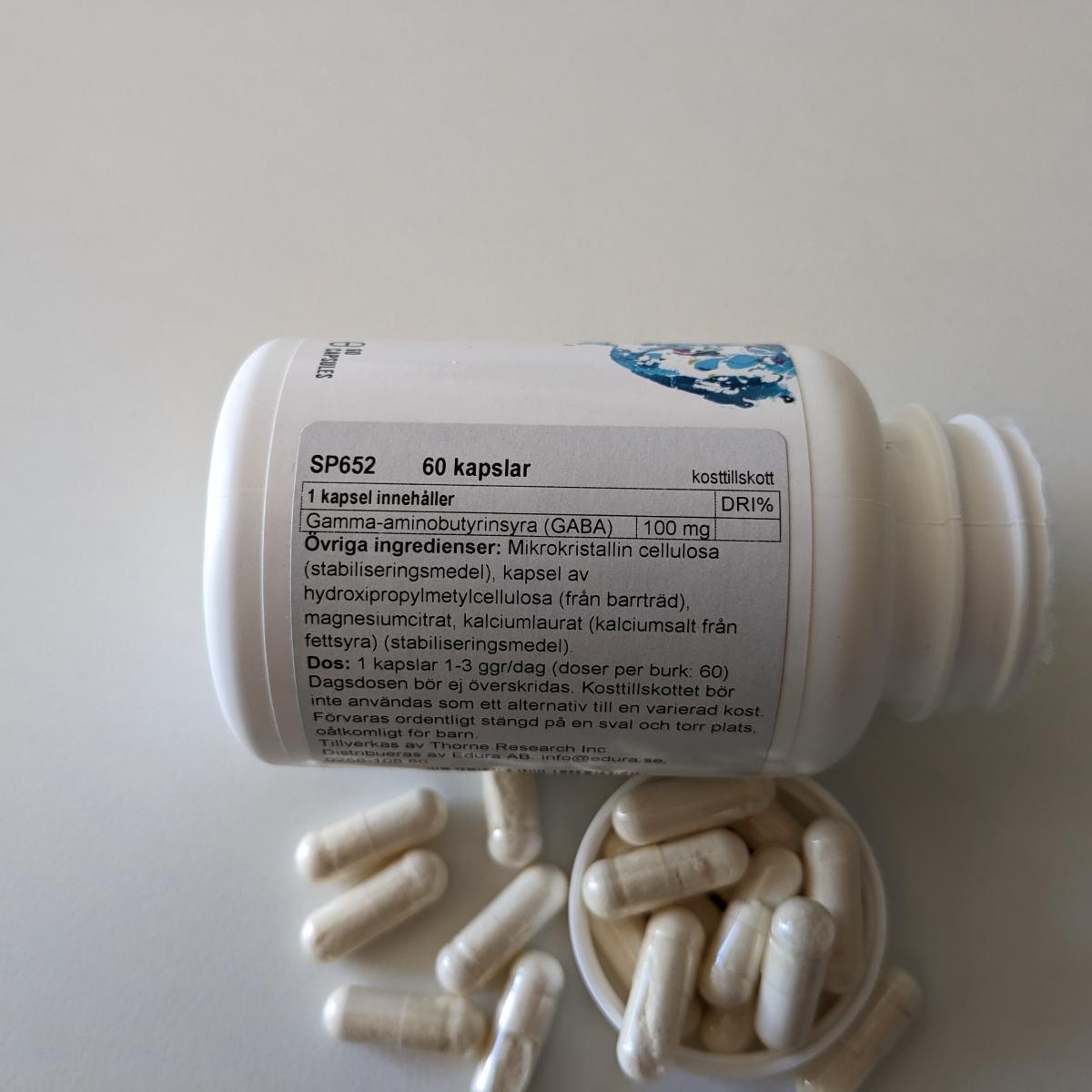 Innehållsetikett Thorne PharmaGABA-100 100 mg per kapsel, foto av oss
